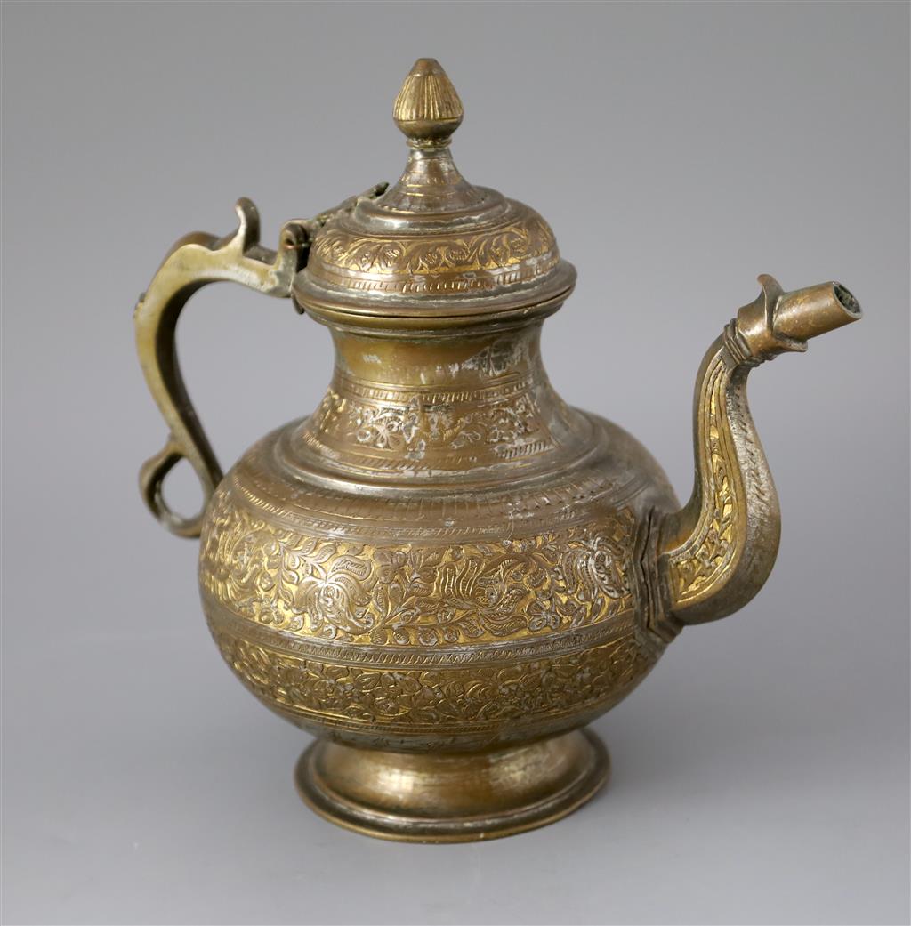 An 18th century Mughal Indian bronze and parcel gilt ewer, 26cm high